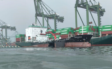 Singapore rushes to deal with oil spill after dredger collision